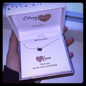sterling silver heart/moon necklace.